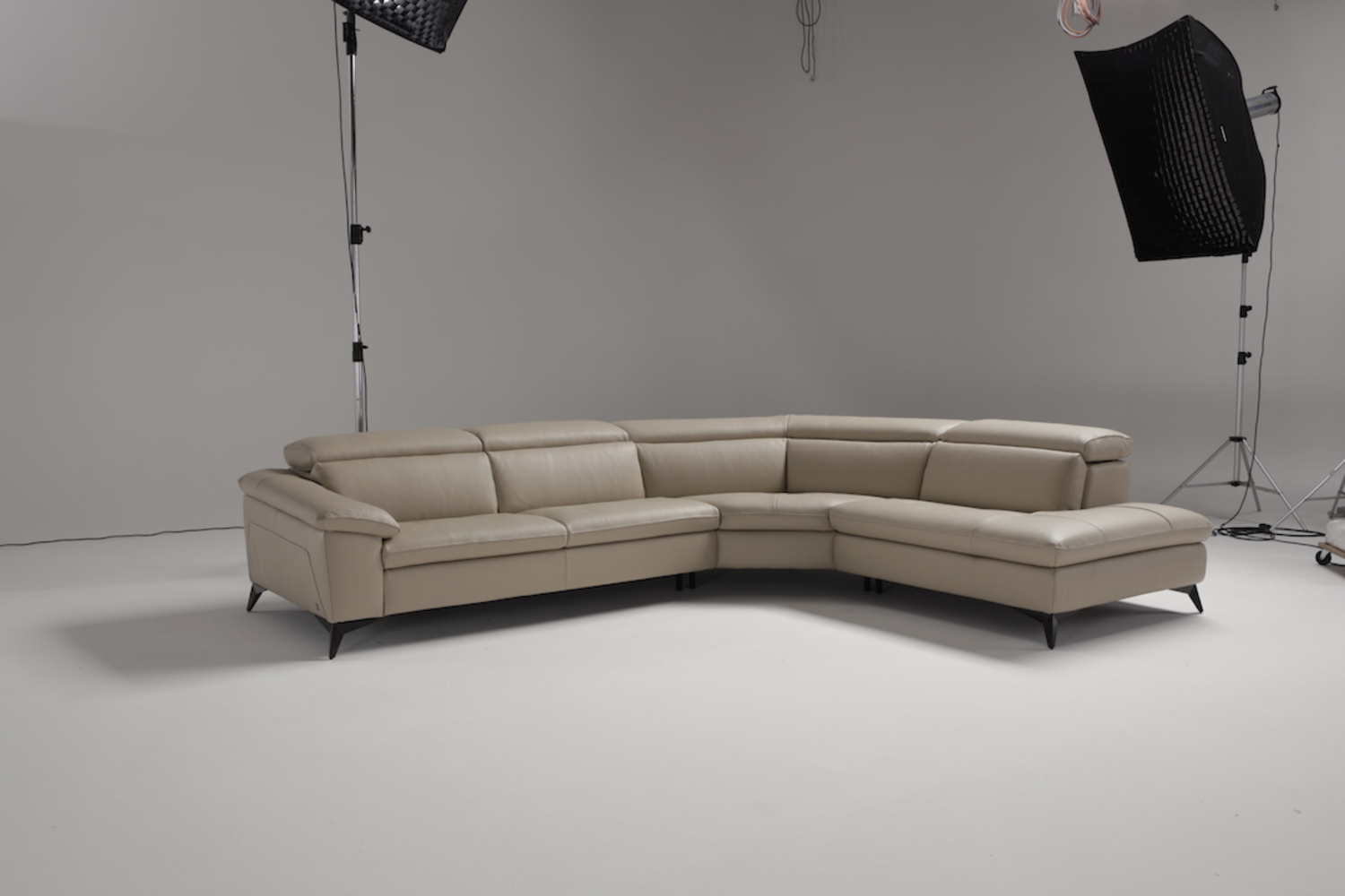 Martine, Leather Sectional with Mechanical Headrest Mechanism.