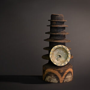 "Echoes of Power: Ekonda Botolo Hat with Eight Tiers and Sun-Marked Disc"