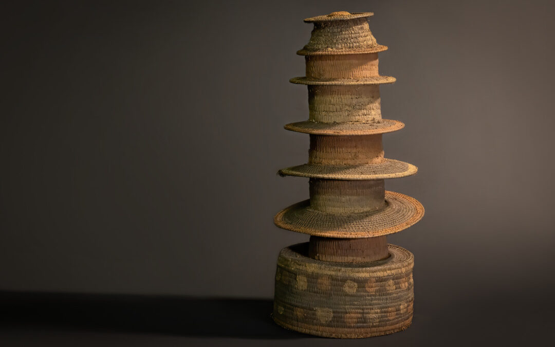 “Sacred Stratification: Ekonda Botolo Hat with Seven Tiers and Ritual Patterned Base”