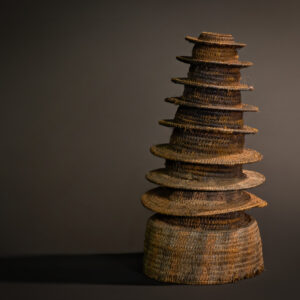 "Cycle of Continuity: Ekonda Botolo Hat with Eleven Tiers Symbolizing Life’s Rhythms"