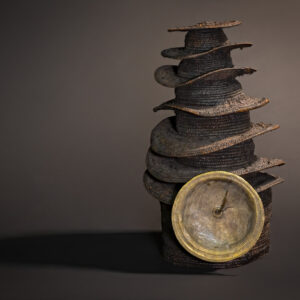 "Crown of Ascent: Ekonda Botolo Hat with Spiraling Tiers and Warrior's Medallion"